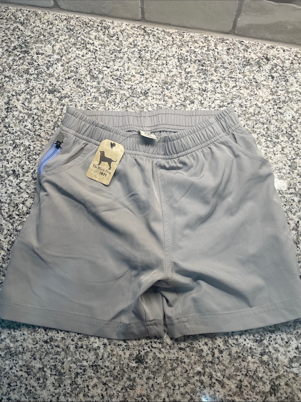 The Black Dog light gray kids shorts with blue zipper trim